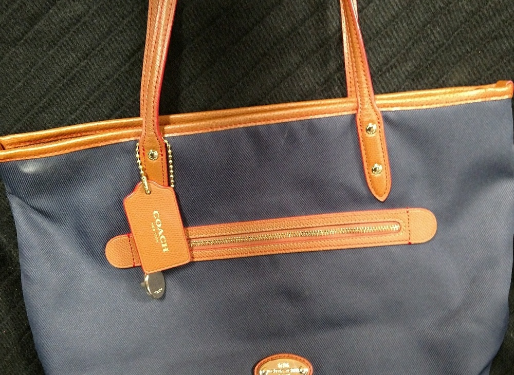 Navy blue shoulder bag with purple interior